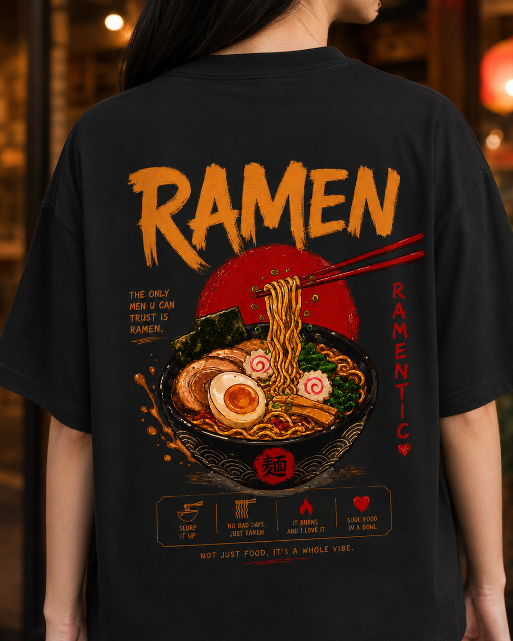 Black t-shirt with ramen graphic and text on the back, worn by a person.