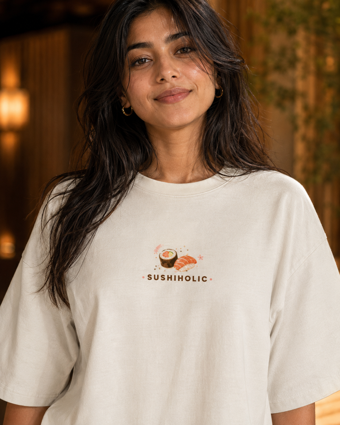 Woman wearing a white t-shirt with 'SushiHolic' design